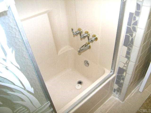 1916 Hadley Road Raleigh, NC 27610 - Photo 11 of 11 a bathroom with a tub