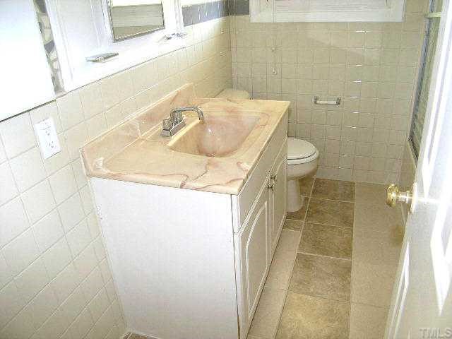 1916 Hadley Road Raleigh, NC 27610 - Photo 8 of 11 a bathroom with a sink and a toilet