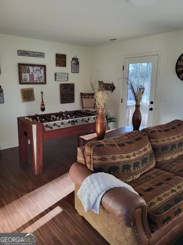 a living room with fireplace furniture and a flat screen tv