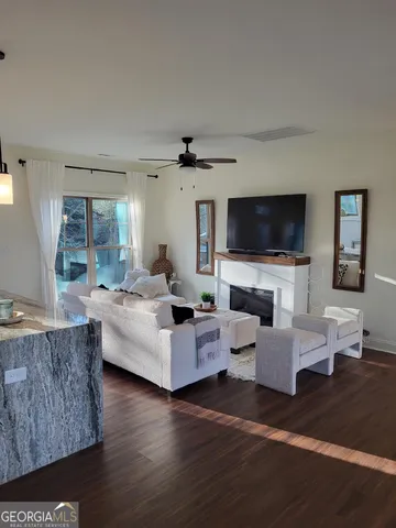 a view of an entryway with wooden floor