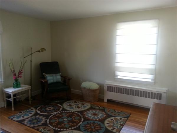 29 Myopia Road Boston, MA 02136 - Photo 11 of 17 a living room with furniture and a window