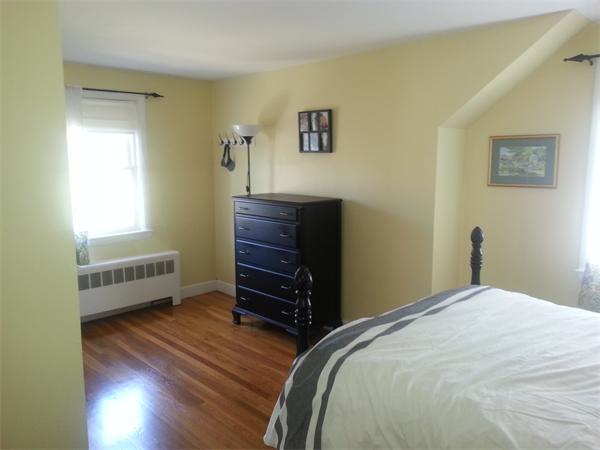 29 Myopia Road Boston, MA 02136 - Photo 8 of 17 a bedroom with a bed and a dresser