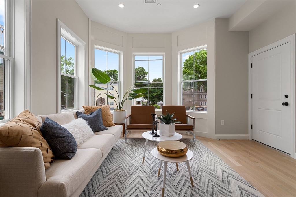 32 Wentworth Street, Unit 2 Boston, MA 02124 - Photo 3 of 23 a living room with furniture and a large window