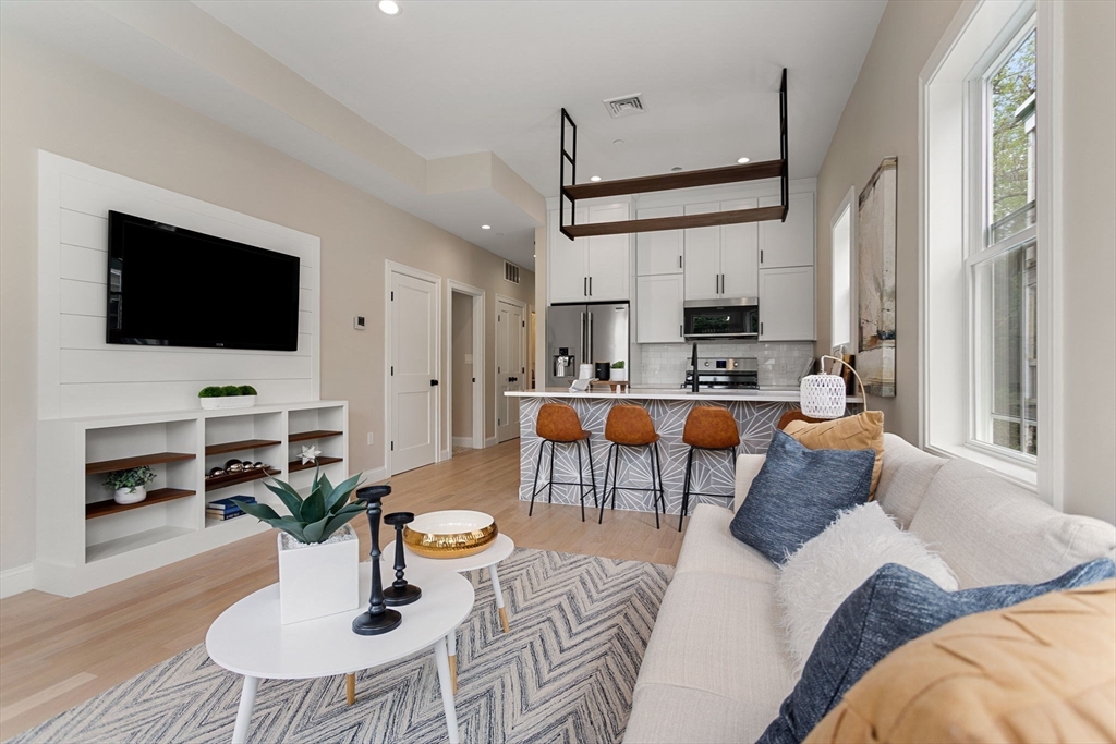 32 Wentworth Street, Unit 2 Boston, MA 02124 - Photo 4 of 23 a living room with furniture and a flat screen tv