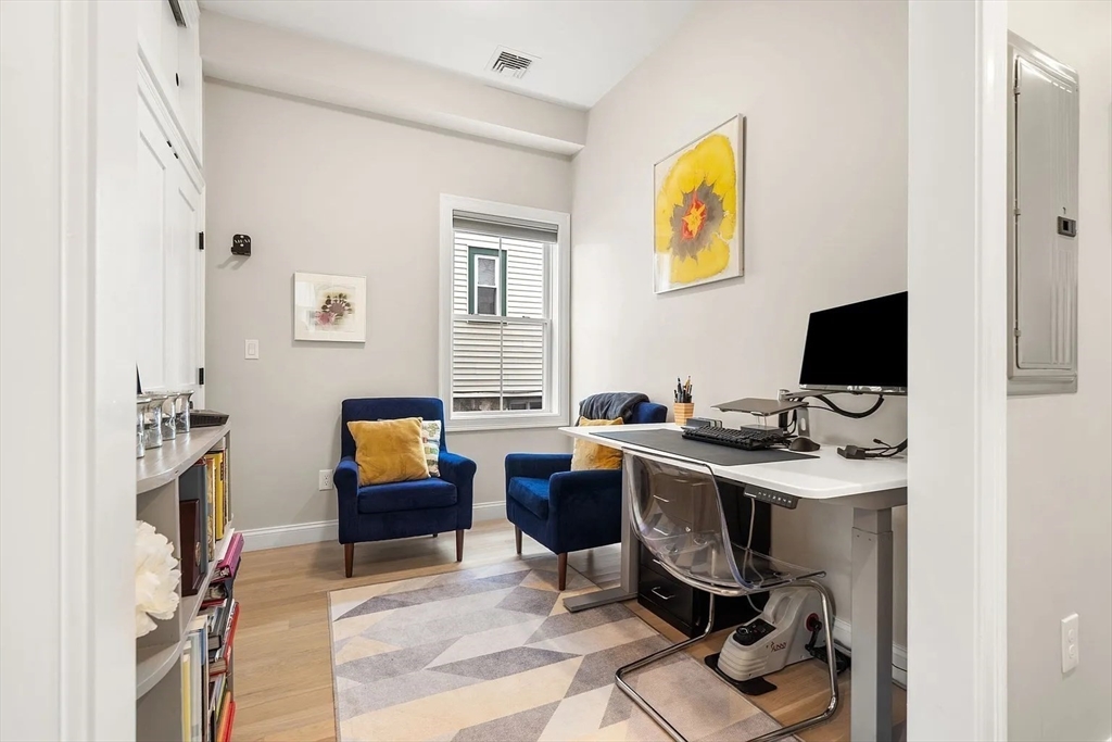32 Wentworth Street, Unit 2 Boston, MA 02124 - Photo 9 of 23 a view of a workspace with furniture and a window