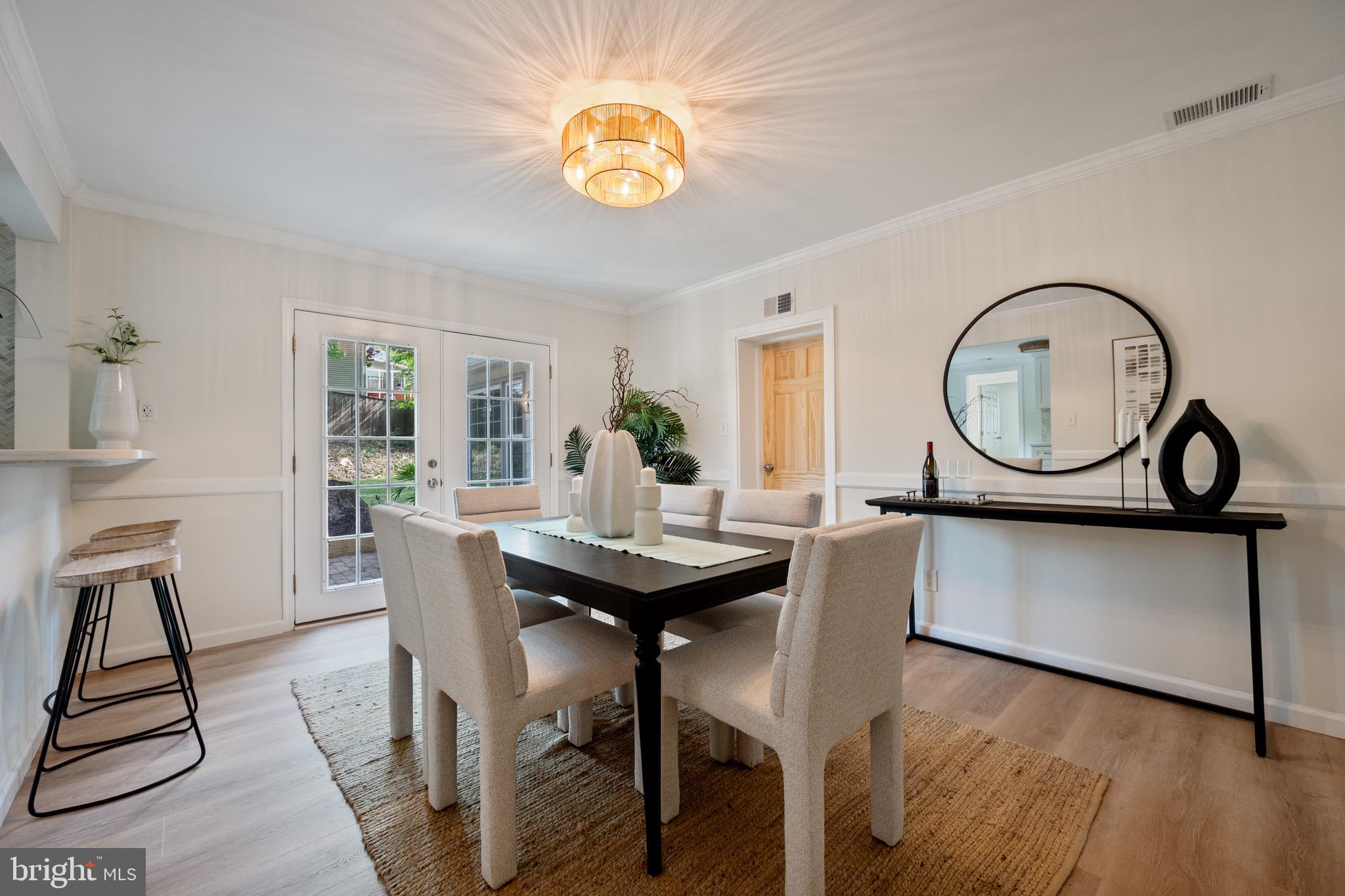 6001 Beech Tree Drive Alexandria, VA 22310 - Photo 23 of 63 a view of a dining room with furniture and a chandelier
