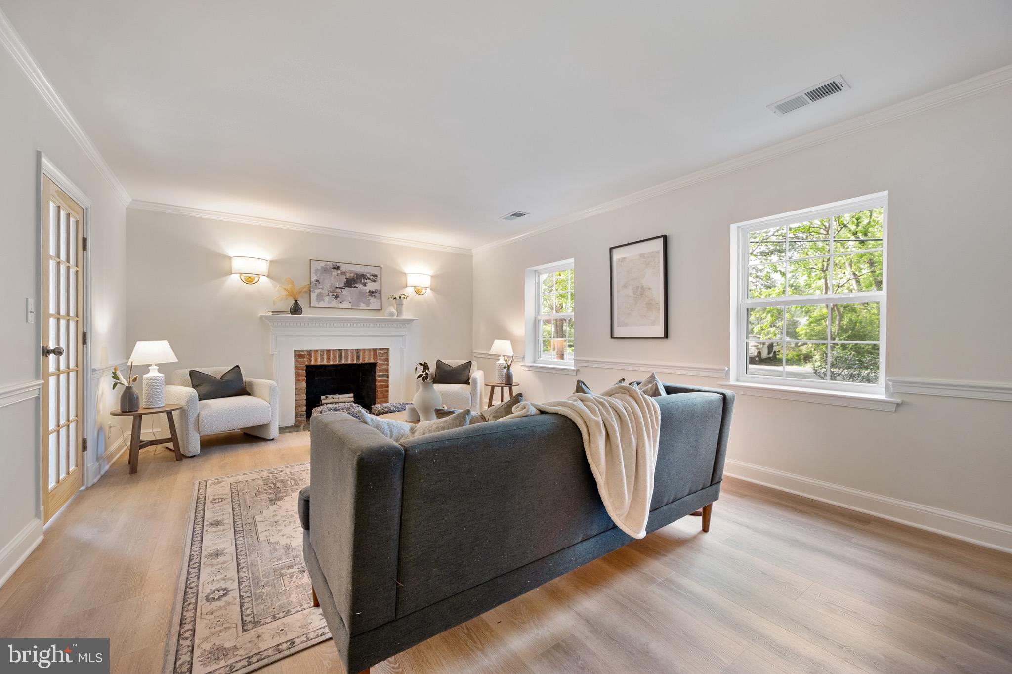 6001 Beech Tree Drive Alexandria, VA 22310 - Photo 44 of 63 a living room with furniture a fireplace and a window