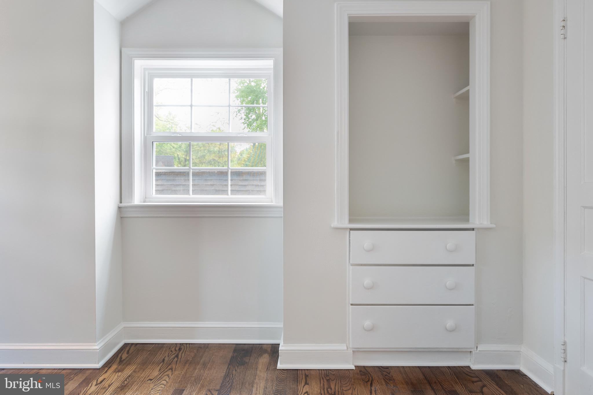 6001 Beech Tree Drive Alexandria, VA 22310 - Photo 54 of 63 an empty room with wooden floor and cabinet
