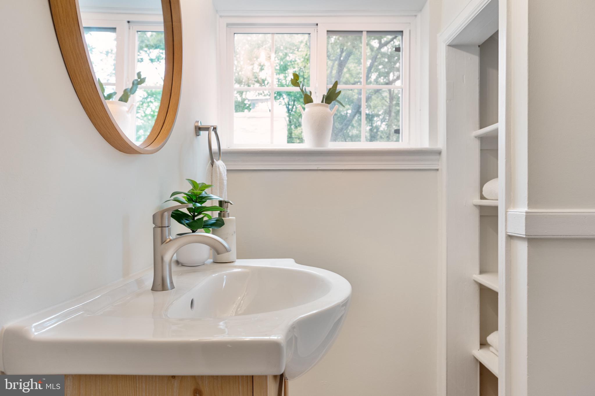 6001 Beech Tree Drive Alexandria, VA 22310 - Photo 57 of 63 a bathroom with a sink and a mirror