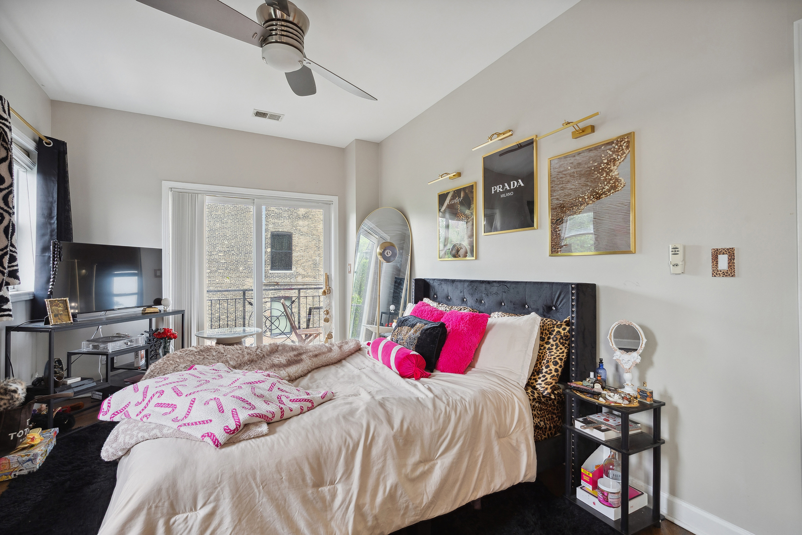 531 North Racine Avenue, Unit 3 Chicago, IL 60642 - Photo 11 of 22 a bedroom with a bed and wooden floor