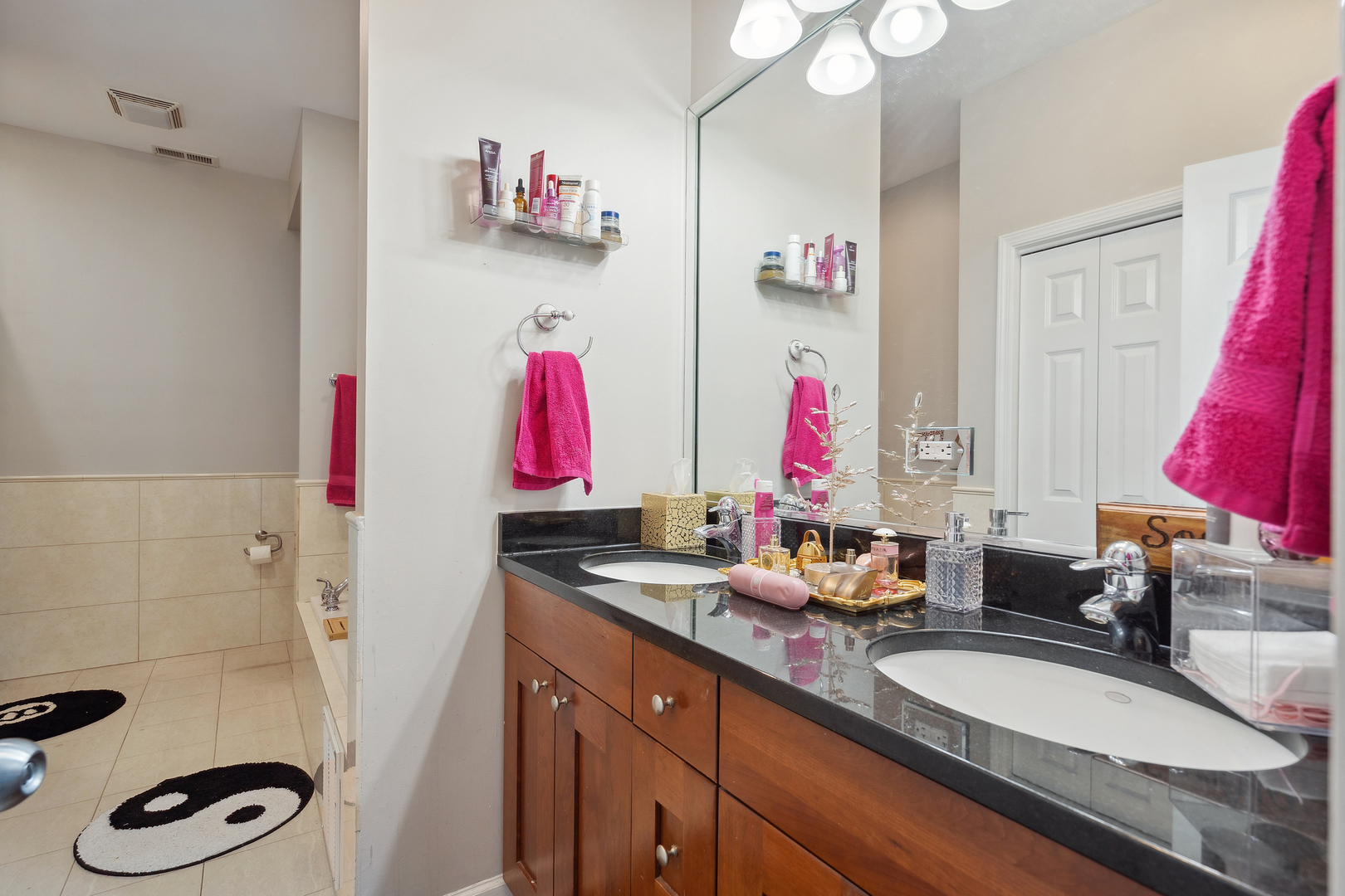 531 North Racine Avenue, Unit 3 Chicago, IL 60642 - Photo 13 of 22 a bathroom with a sink and a mirror