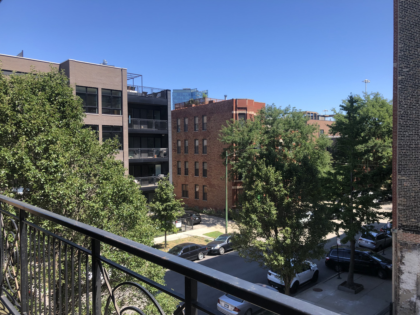 531 North Racine Avenue, Unit 3 Chicago, IL 60642 - Photo 19 of 22 a view of a building from a balcony