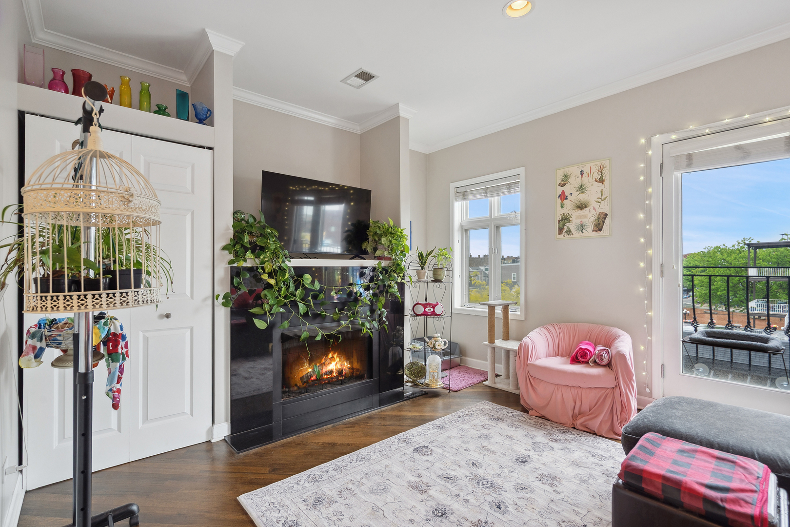 531 North Racine Avenue, Unit 3 Chicago, IL 60642 - Photo 3 of 22 a bedroom with furniture and a flat screen tv