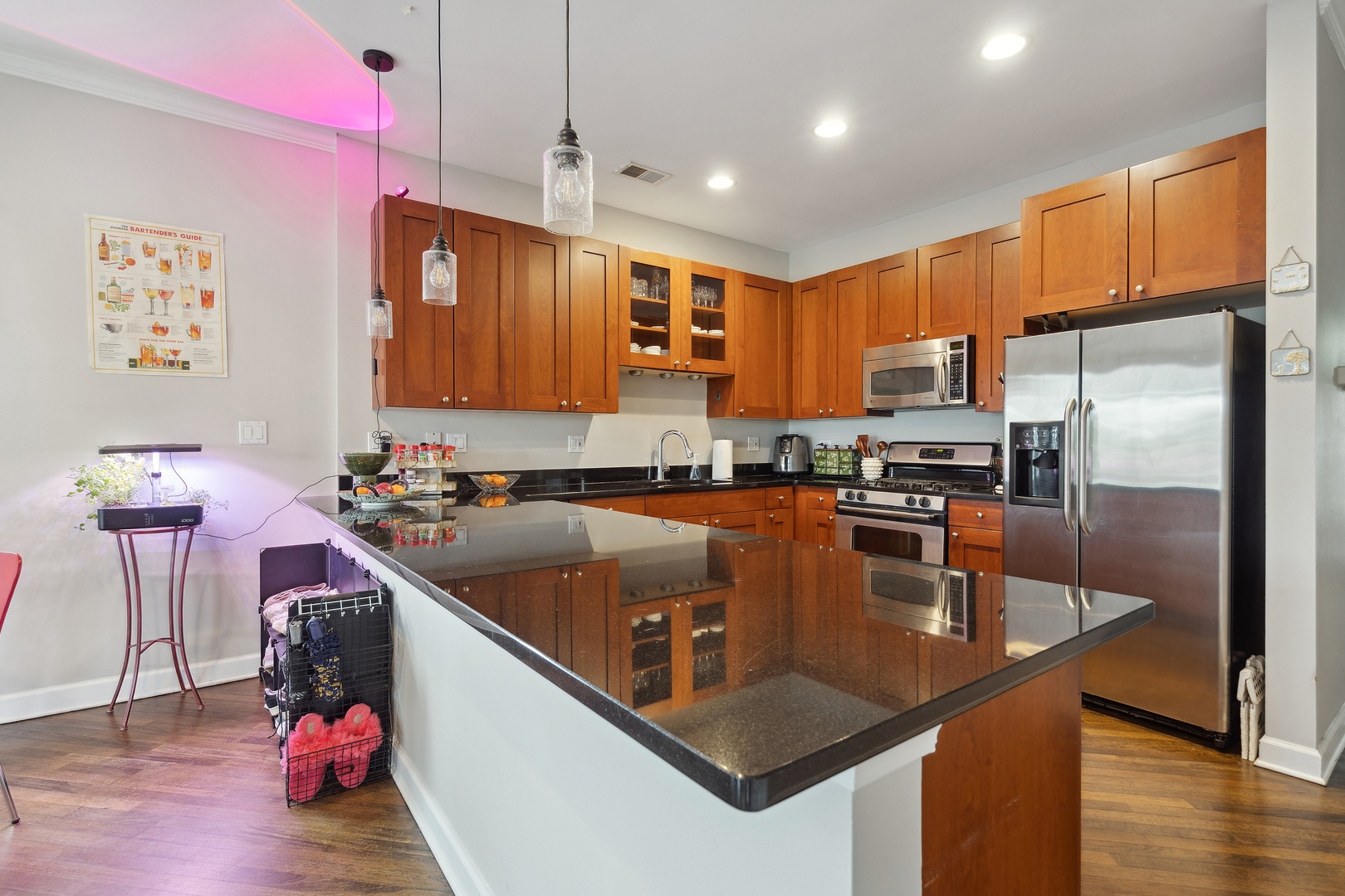 531 North Racine Avenue, Unit 3 Chicago, IL 60642 - Photo 9 of 22 a kitchen with a refrigerator a stove a sink dishwasher with wooden floor and cabinets