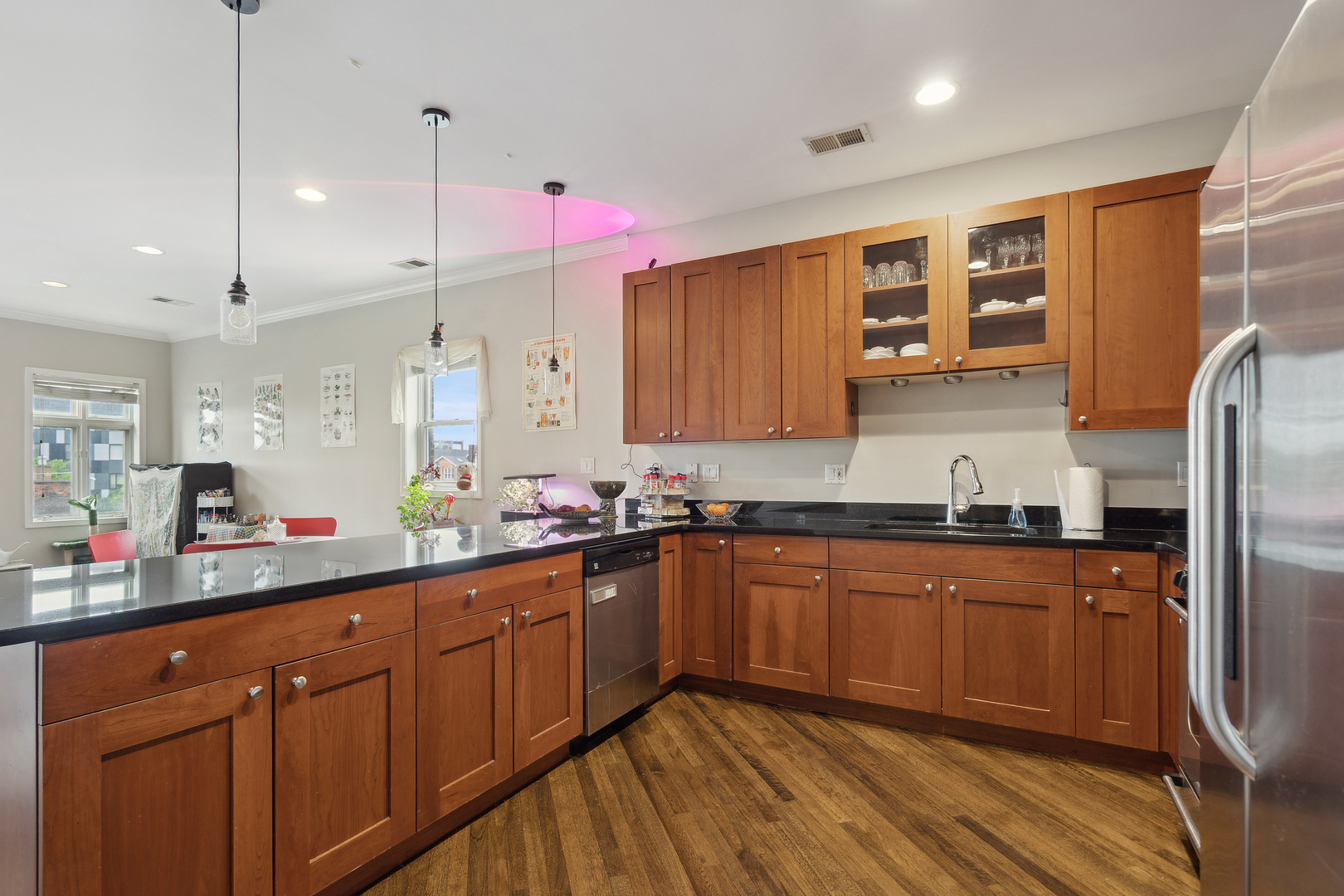531 North Racine Avenue, Unit 3 Chicago, IL 60642 - Photo 10 of 22 a kitchen with stainless steel appliances granite countertop wooden cabinets sink and stove