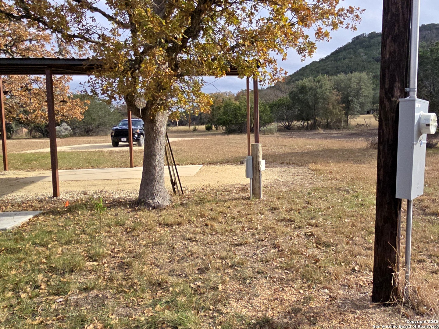 224 Rocky Top Road Medina, TX 78055 - Photo 16 of 38 a view of a yard with a tree