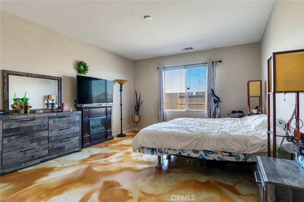 11408 Poppy Road Adelanto, CA 92301 - Photo 12 of 26 primary bedroom with custom epoxy flooring