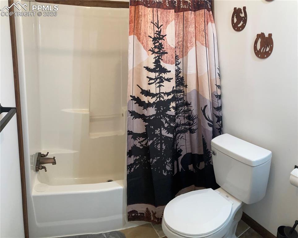 136 Black Knat Road Fairplay, CO 80440 - Photo 15 of 38 a white toilet sitting next to a bath tub