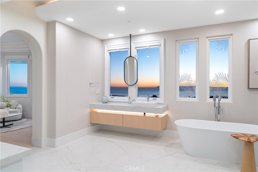 9 Seashell Newport Coast, CA 92657 - Photo 19 of 45 a spacious bathroom with a tub sink and mirror