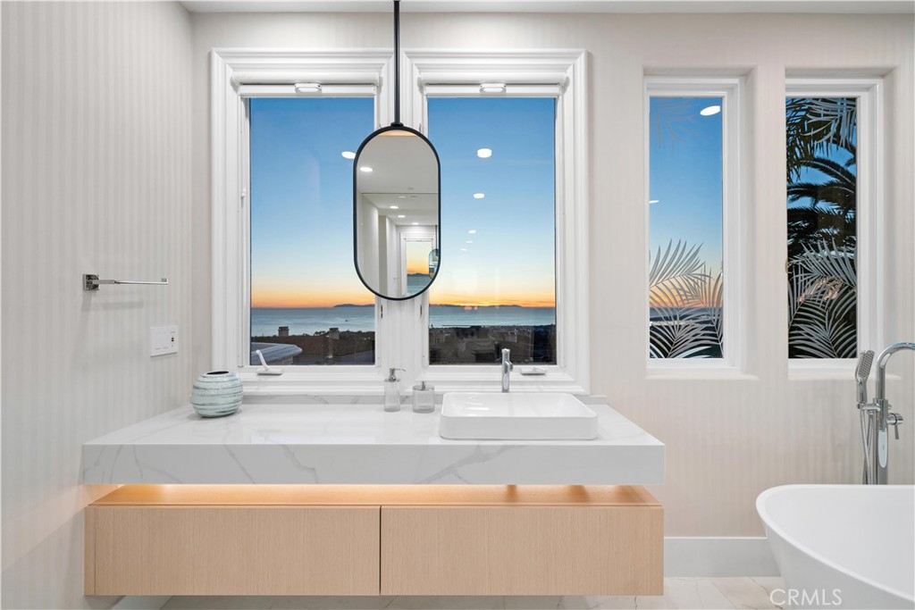 9 Seashell Newport Coast, CA 92657 - Photo 21 of 45 a bathroom with a sink and a mirror
