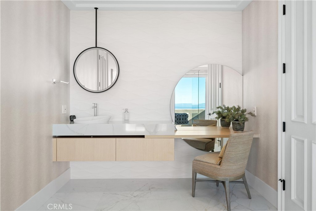 9 Seashell Newport Coast, CA 92657 - Photo 27 of 45 a bathroom with a sink and a mirror