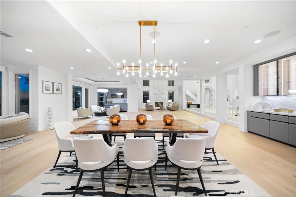 9 Seashell Newport Coast, CA 92657 - Photo 8 of 45 a dining room with furniture a chandelier and wooden floor