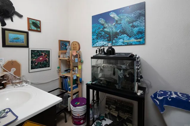 a living room with fireplace furniture and a large window