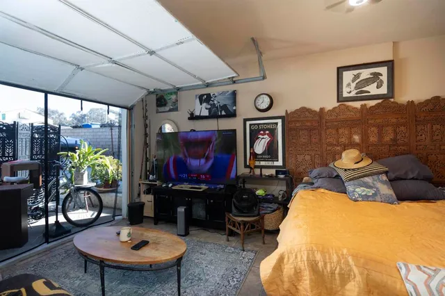 a kitchen with a refrigerator and cabinets