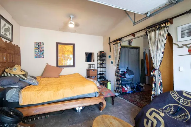 a bathroom with a sink a toilet and shower curtain