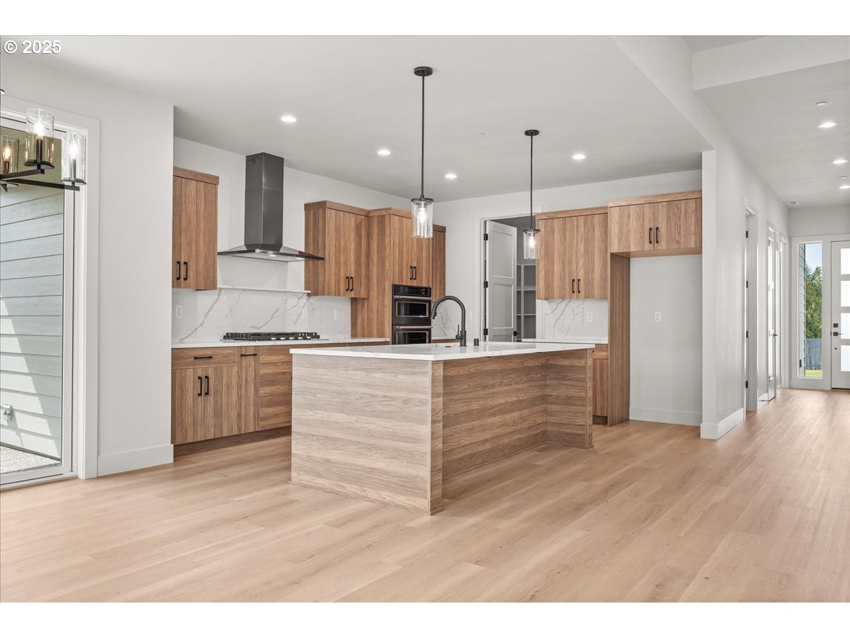 16705 Northeast 38th Avenue Vancouver, WA 98686 - Photo 12 of 45 a view of kitchen with stainless steel appliances kitchen island wooden cabinets and stove