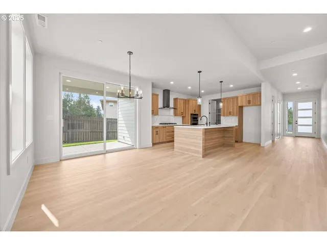 a view of a kitchen with a sink and a window