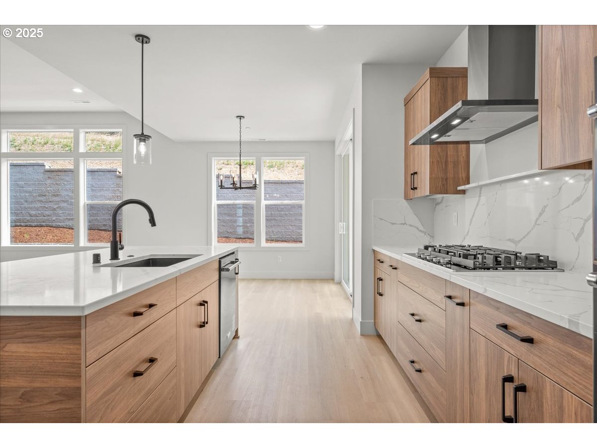 16705 Northeast 38th Avenue Vancouver, WA 98686 - Photo 18 of 45 a kitchen with a sink stove and cabinets