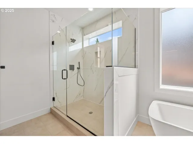 a bathroom with a shower and a toilet