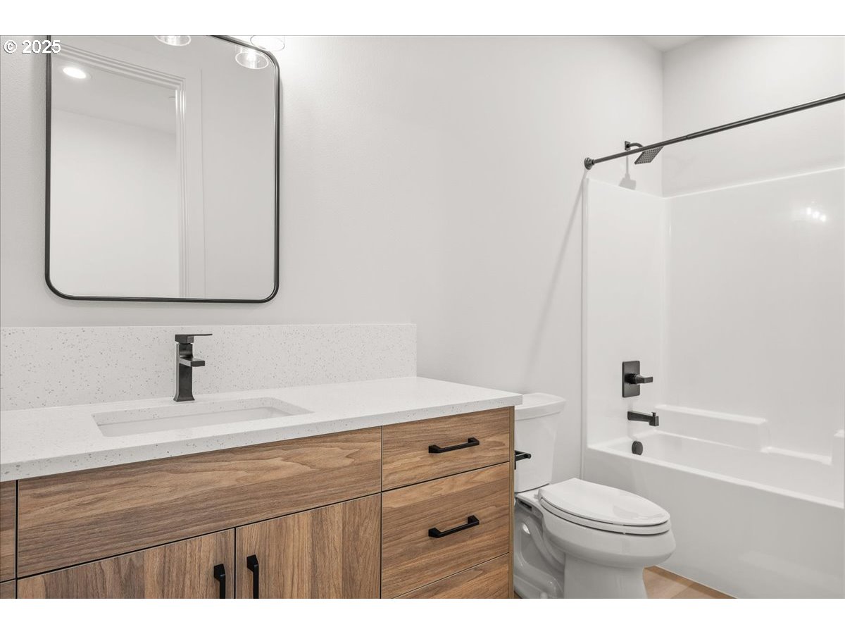 16705 Northeast 38th Avenue Vancouver, WA 98686 - Photo 29 of 45 a bathroom with a sink a toilet and shower