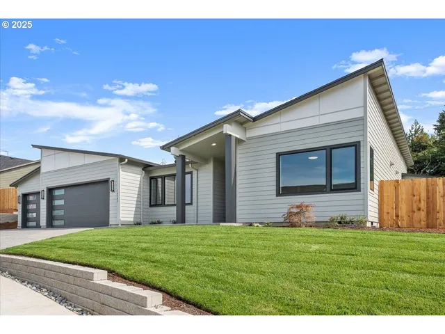 a front view of a house with a garage