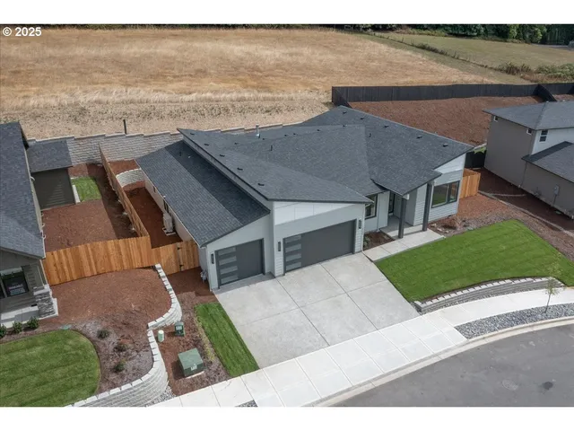 a view of house with yard and ocean view