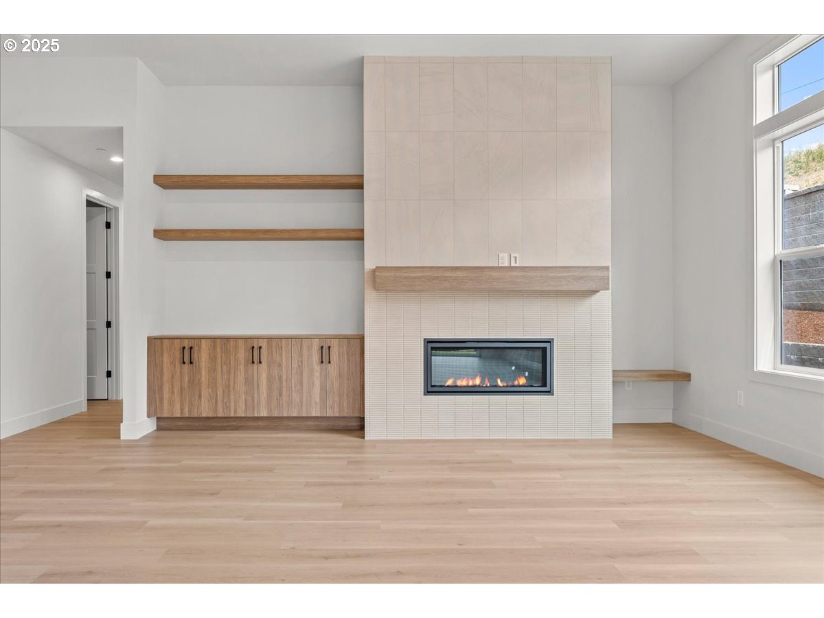 16705 Northeast 38th Avenue Vancouver, WA 98686 - Photo 8 of 45 a view of an empty room with wooden floor and a window