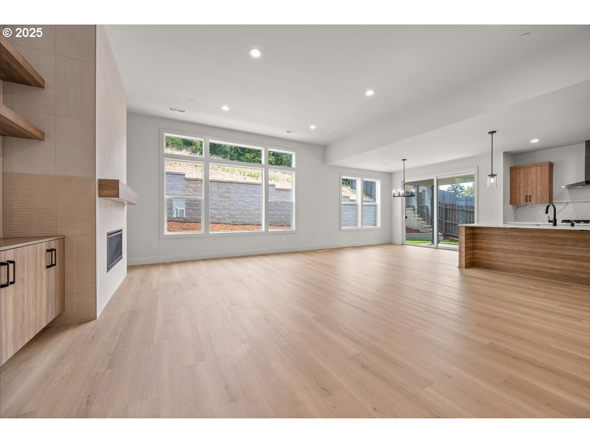 16705 Northeast 38th Avenue Vancouver, WA 98686 - Photo 9 of 45 a view of an empty room with wooden floor and a window