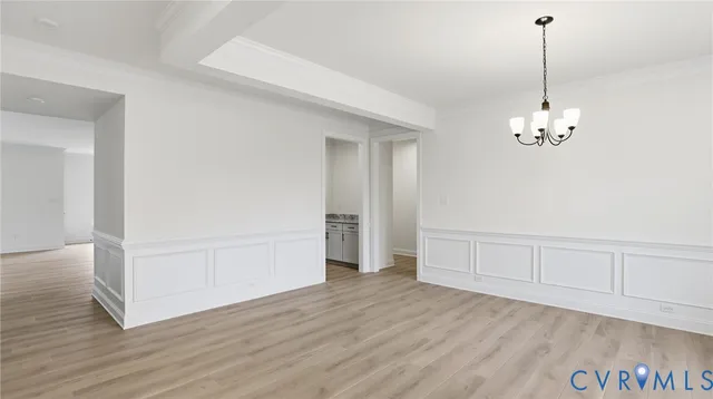 a large kitchen with stainless steel appliances granite countertop a stove a sink and a refrigerator