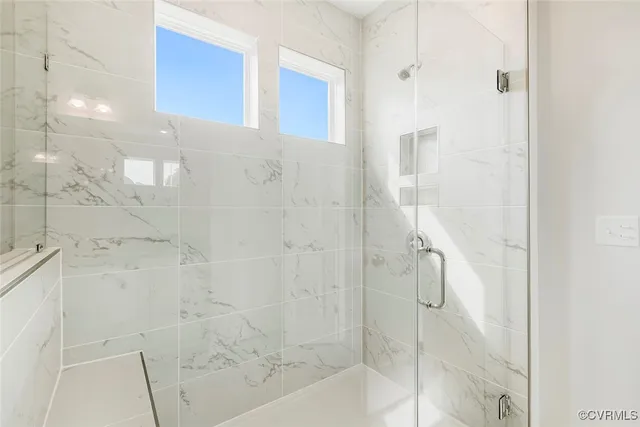 a bathroom with a double vanity sink and mirror
