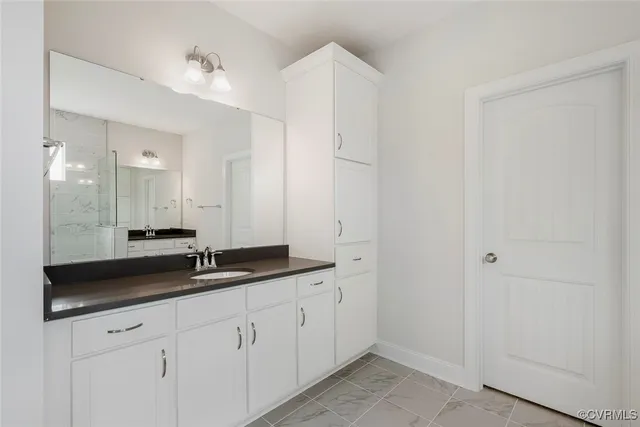 a view of a room with an empty space and a hallway