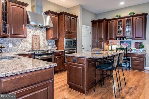 6324 Still Spring Place Alexandria, VA 22315 - Photo 20 of 30 Kitchen Has Island and Granite Counters