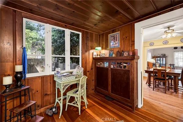 a view of a dining room with furniture wooden floor and chandelier