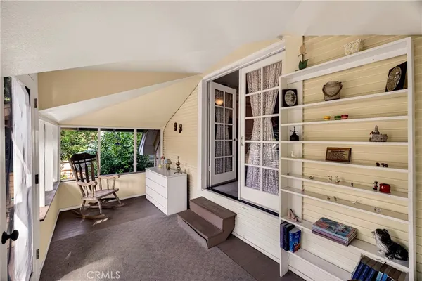 a view of living room with furniture and large window