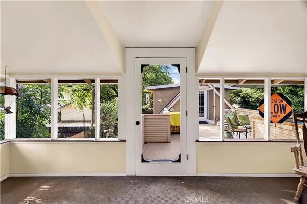 a view of a dinning table and chairs in the patio