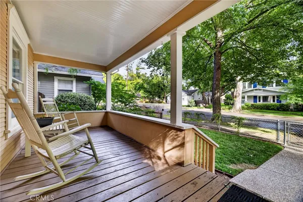 a view of a house with backyard sitting area and garden