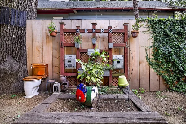 a view of backyard with deck and seating space