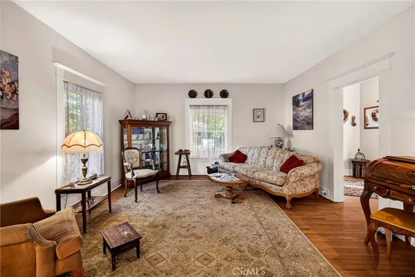a living room with furniture rug and window