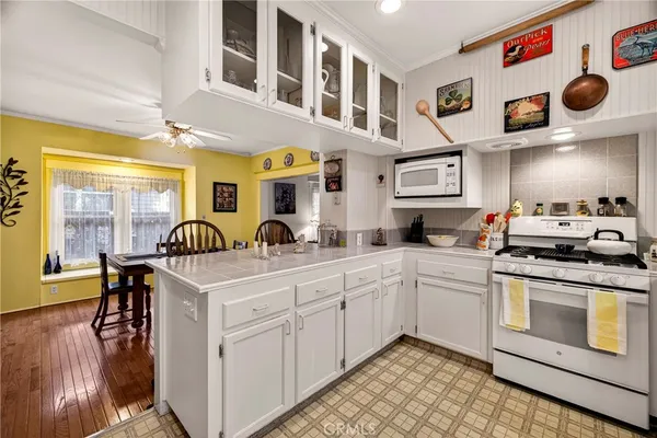 a kitchen with stainless steel appliances granite countertop a sink and cabinets