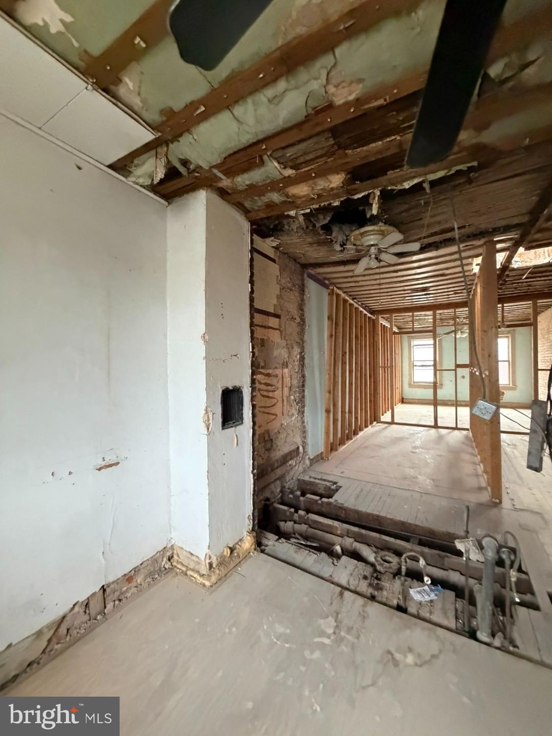 12 South Kresson Street Baltimore, MD 21224 - Photo 21 of 29 a bed sitting in a room next to a window